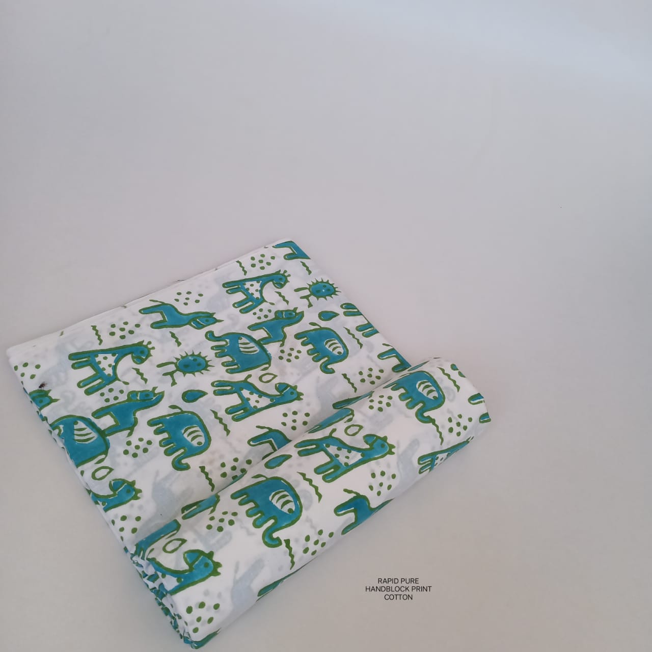 Jaipur Sanganeri Handblock Cotton Fabric in white and blue with horse and camel print, artisan-crafted for boutiques, designers, and retailers.